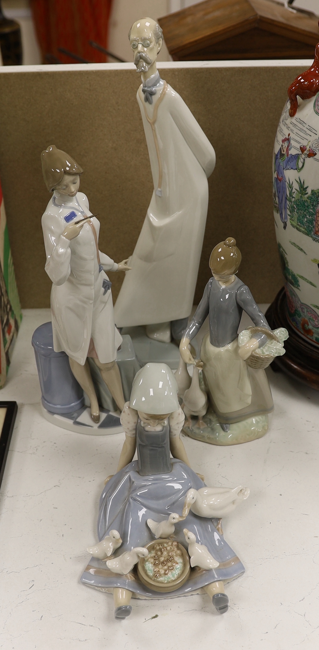 A group of four LLadro figures, tallest 41cm